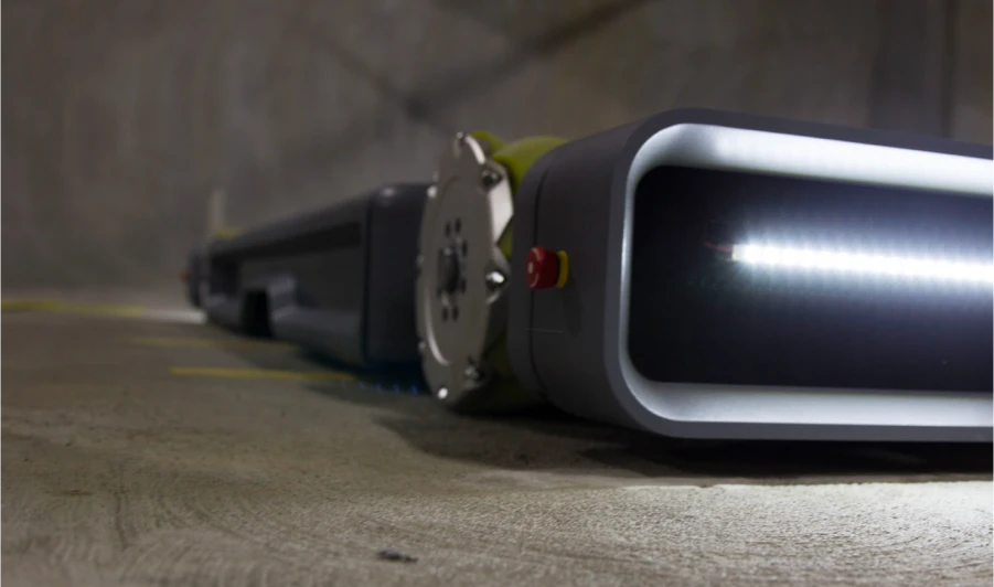 Volley Automation parking robot, photographed from a low angle, showing the front lights and front corner wheel.
